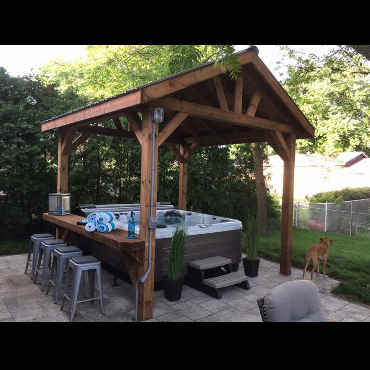 Timber frame shelter over hot tub with bar area