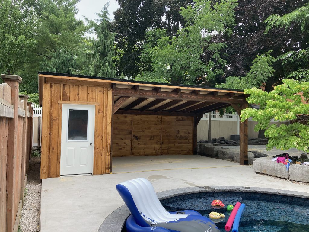 Pool changing room shed with large covered seating area