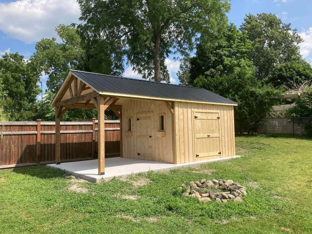 Backyard shed with large covered porch