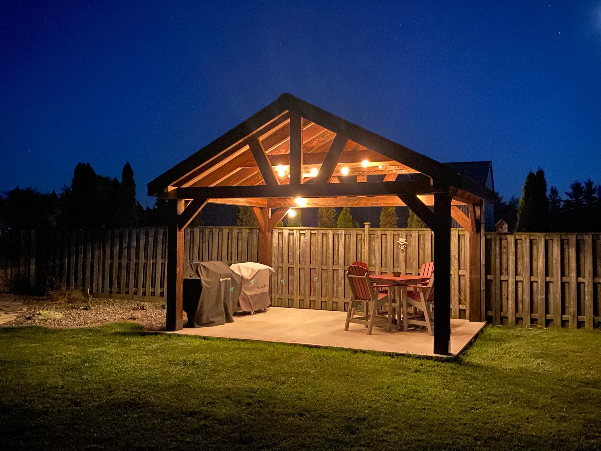 Timber frame BBQ and patio area with lighting